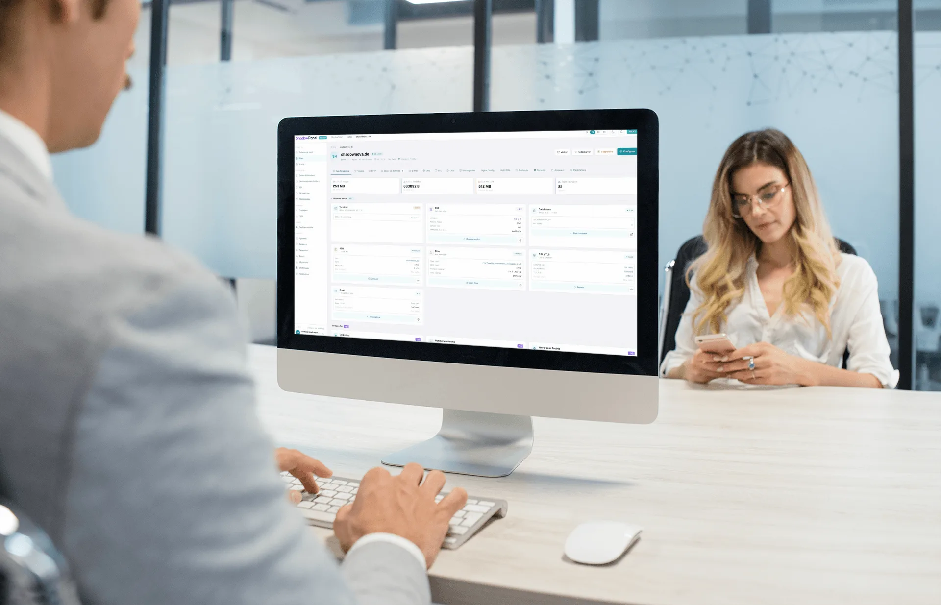 A team using the ShadowPanel dashboard on a desktop workstation in an office